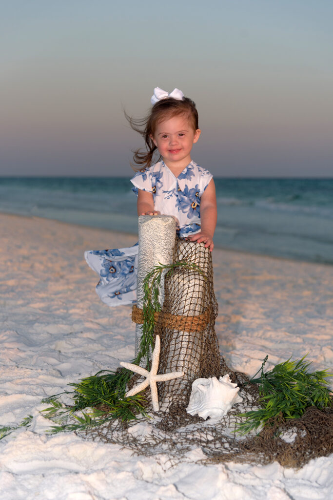 Little girl posing on Destin beach at dusk.
