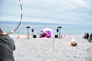 Photo of musicians and beach bonfire