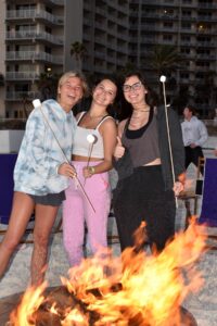 Girls with marshmallows smiling for the camera