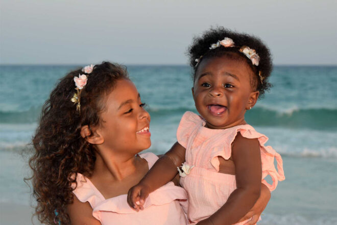 Adorable baby smiling big for the camera.